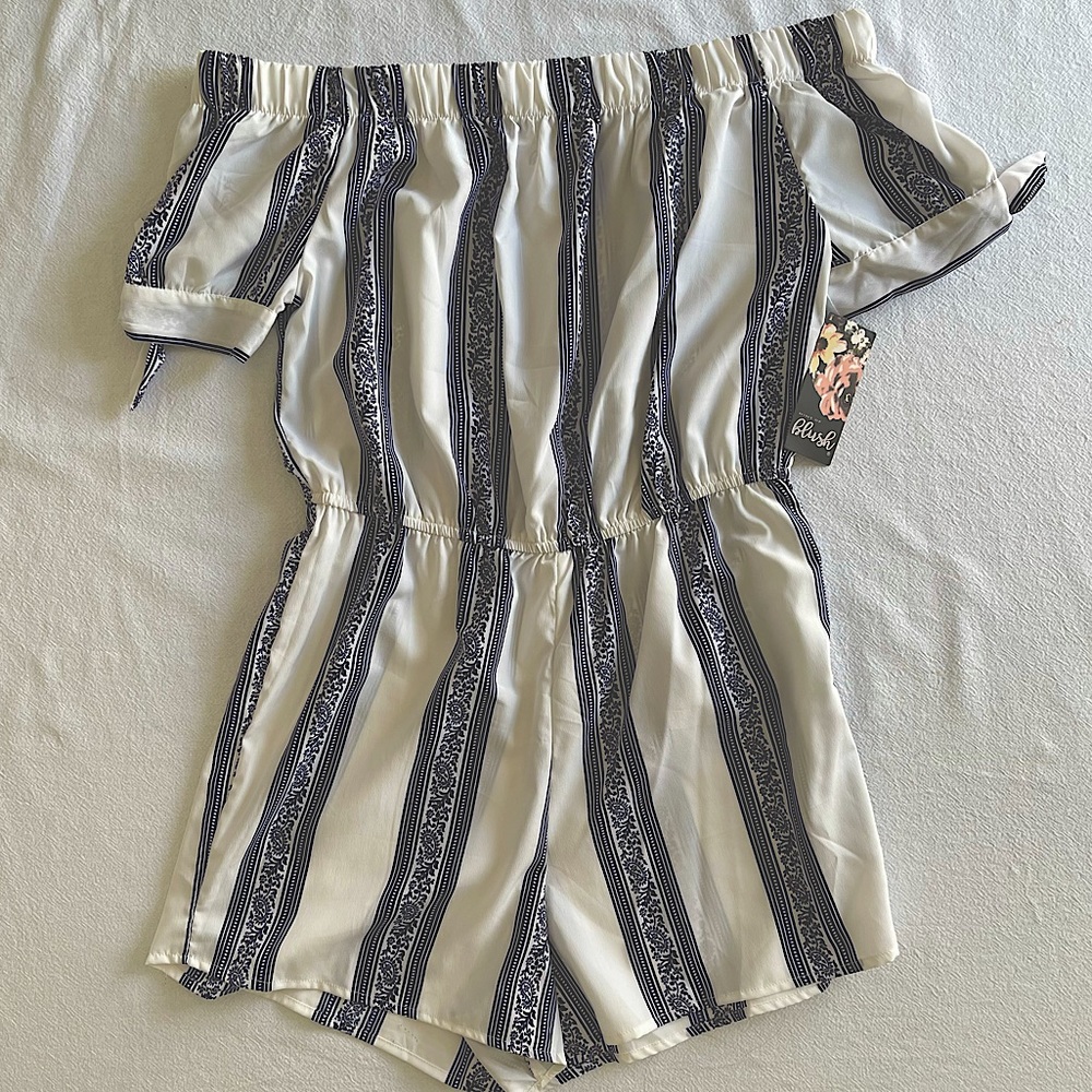 Woman’s blue & white Hint of blush romper.
